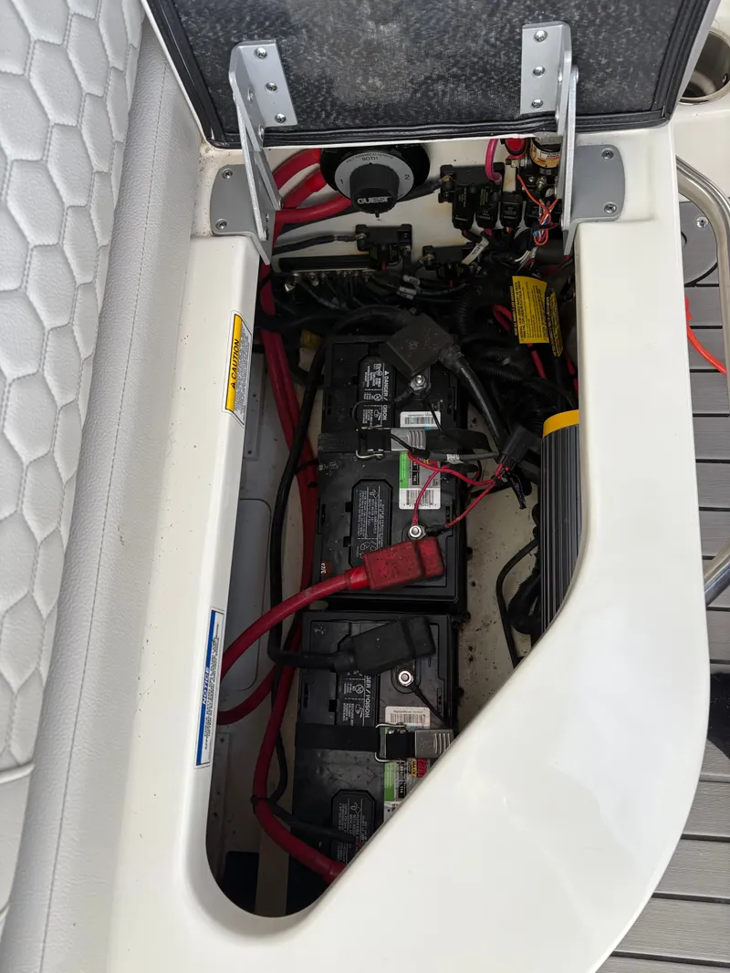 Slide: The Image of Battery compartment of a 2020 Sea Ray SDX 270 boat. - 16