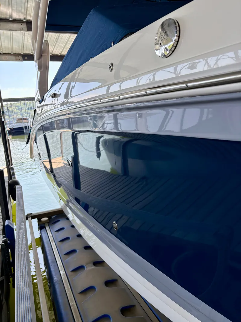 Slide: The Image of 2020 Sea Ray SDX 270 boat in dock, side view. - 18