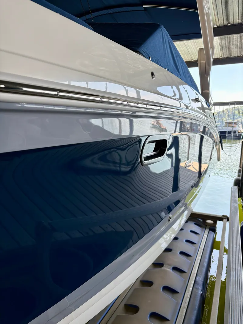 Slide: The Image of 2020 Sea Ray SDX 270 boat docked at marina. - 19