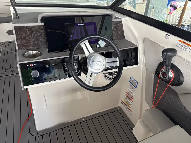 Slide: The Image of 2020 Sea Ray SDX 270 helm with modern electronics and controls. - 6