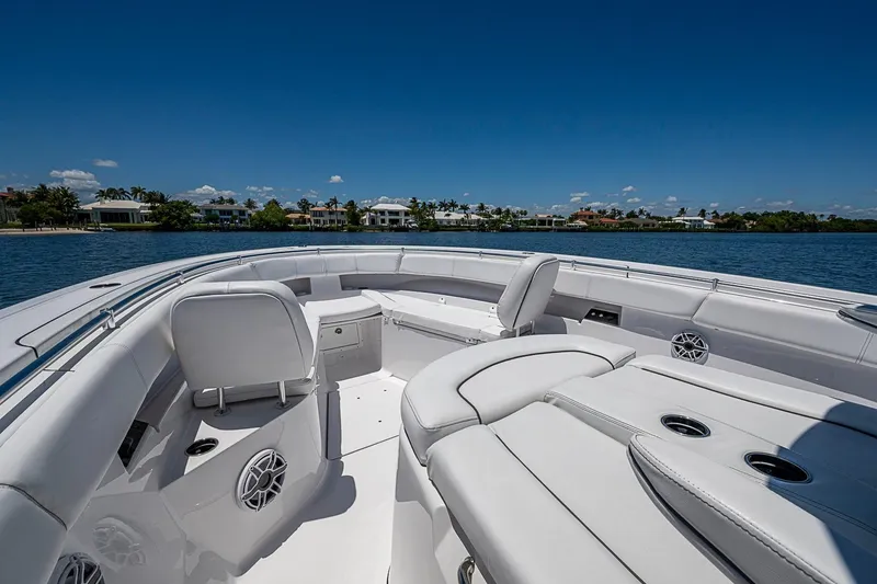 Slide: The Image of 2023 Sportsman Open 352 Center Console boat interior with luxurious seating and ocean view. - 14