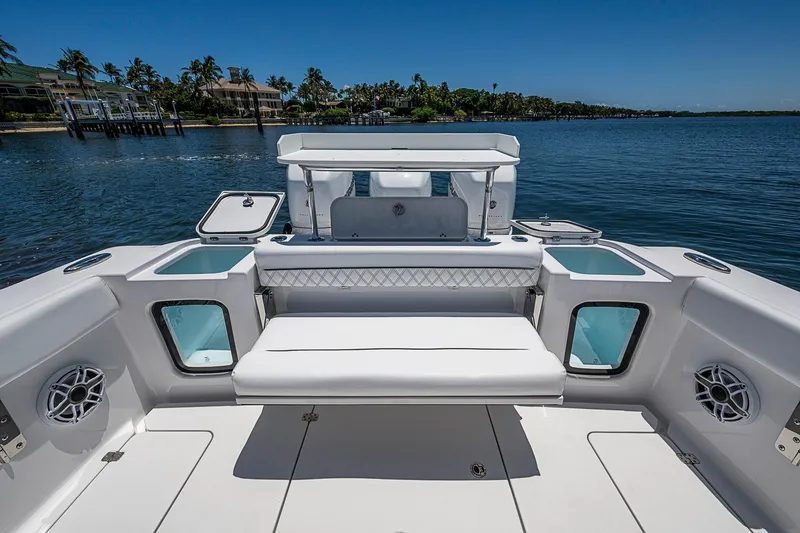 Slide: The Image of 2023 Sportsman Open 352 Center Console boat interior with seating and ocean view. - 17
