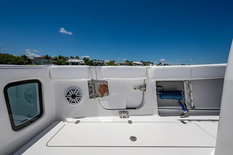 Slide: The Image of 2023 Sportsman Open 352 Center Console boat deck with storage and speaker. - 18