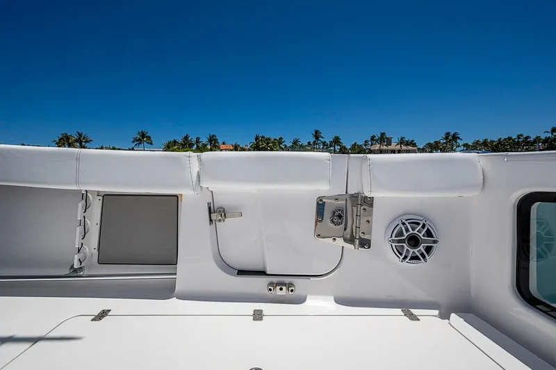 Slide: The Image of 2023 Sportsman Open 352 Center Console boat interior with speaker and storage compartments. - 20