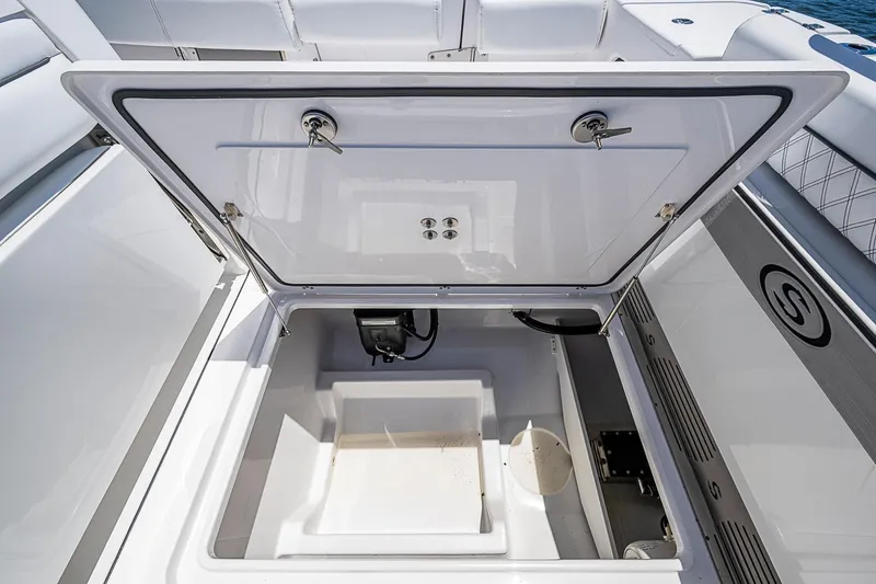 Slide: The Image of 2023 Sportsman Open 352 Center Console storage compartment open, showcasing interior features. - 21