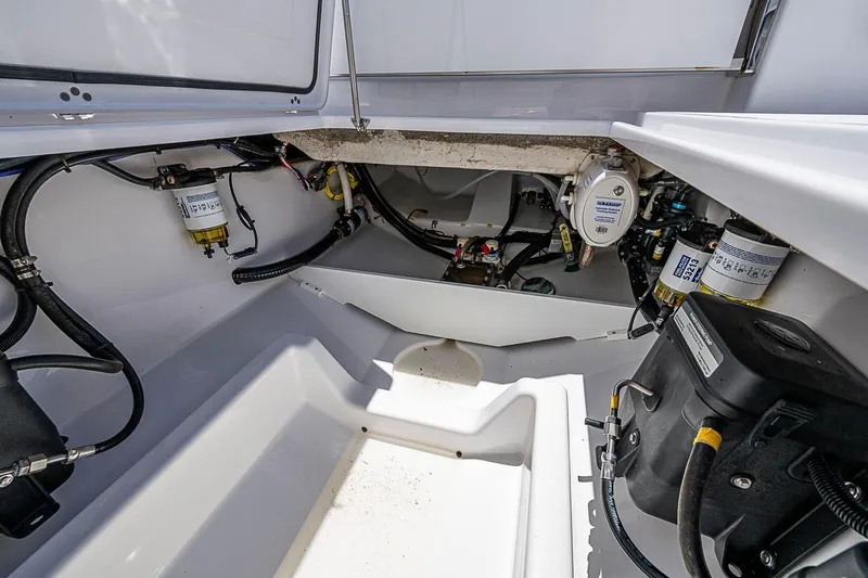 Slide: The Image of 2023 Sportsman Open 352 Center Console engine compartment with visible wiring and components. - 22