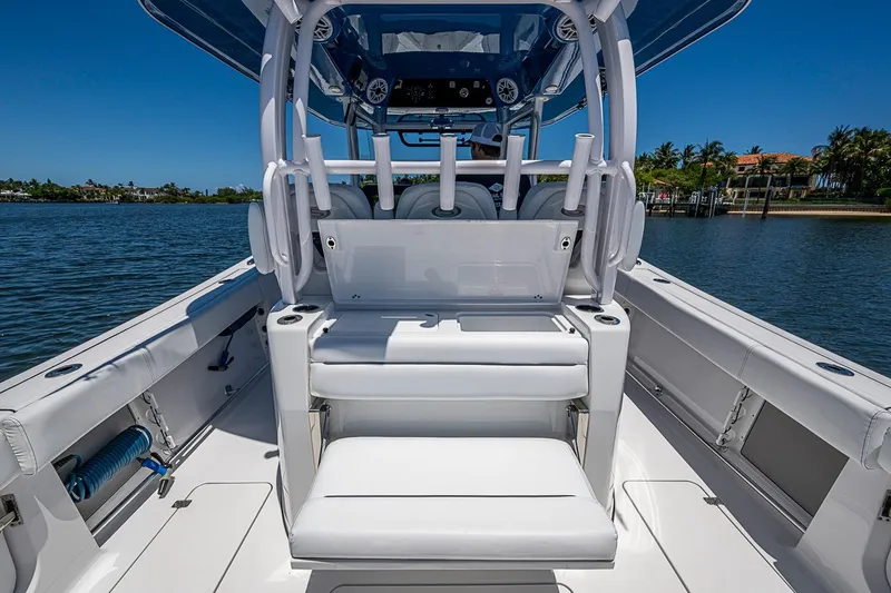 Slide: The Image of 2023 Sportsman Open 352 Center Console boat interior with seating and ocean view. - 24