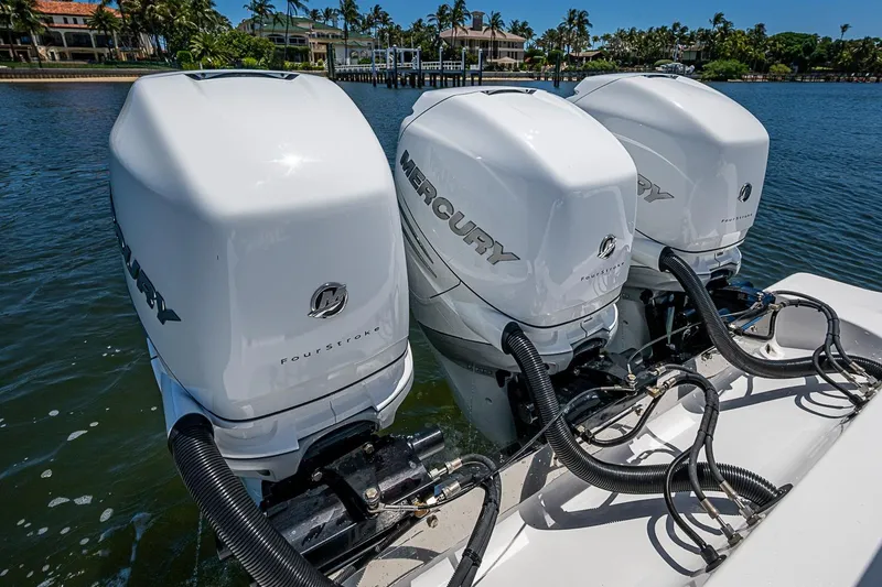 Slide: The Image of Triple Mercury outboard engines on a 2023 Sportsman Open 352 Center Console boat. - 25