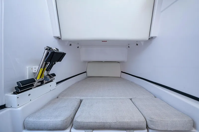 Slide: The Image of 2023 Sportsman Open 352 Center Console cabin interior with cushioned seating. - 27