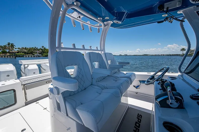 Slide: The Image of 2023 Sportsman Open 352 Center Console boat interior with luxurious seating and ocean view. - 7