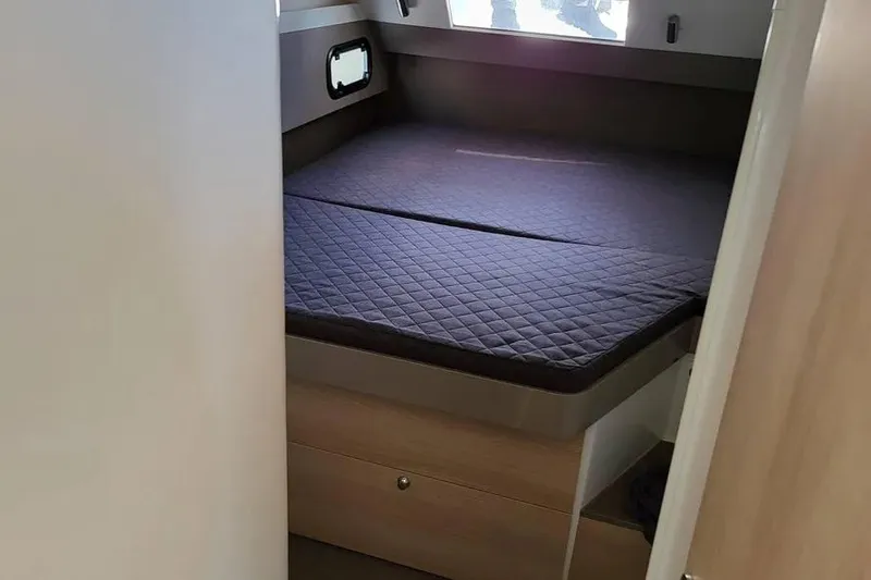Slide: The Image of Cozy cabin interior of 2019 Bali 4.3 catamaran with quilted bedding. - 8