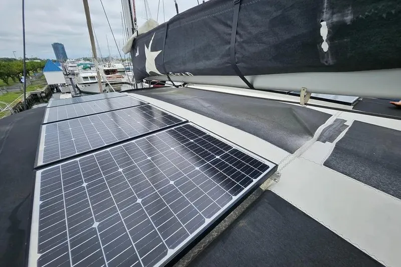 Slide: The Image of Solar panels on a 2019 Bali 4.3 catamaran, docked at a marina. - 9