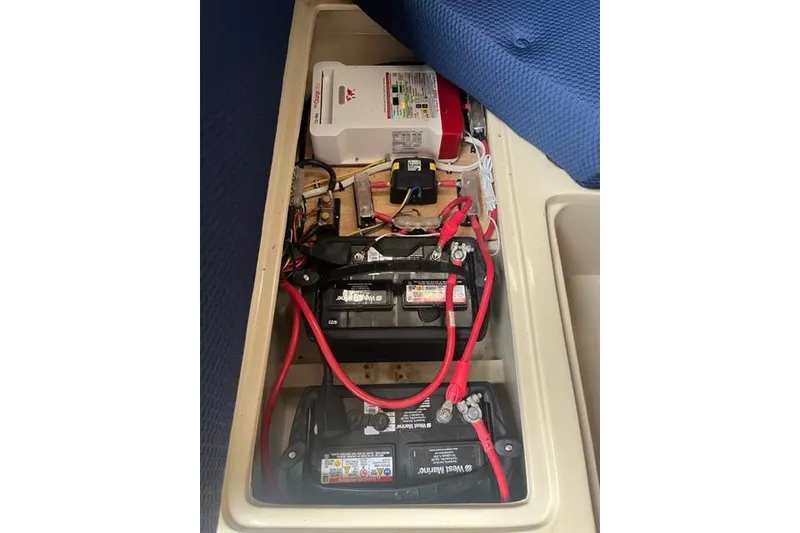 Slide: The Image of Battery compartment of a 1982 Catalina 38 sailboat with wiring and components. - 15