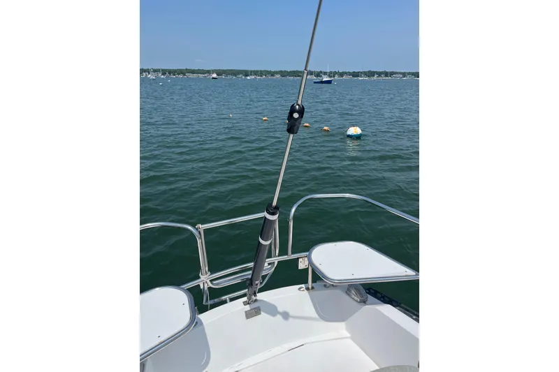 Slide: The Image of Sailboat deck view on water, Catalina 38, 1982 model, with buoys in the distance. - 7