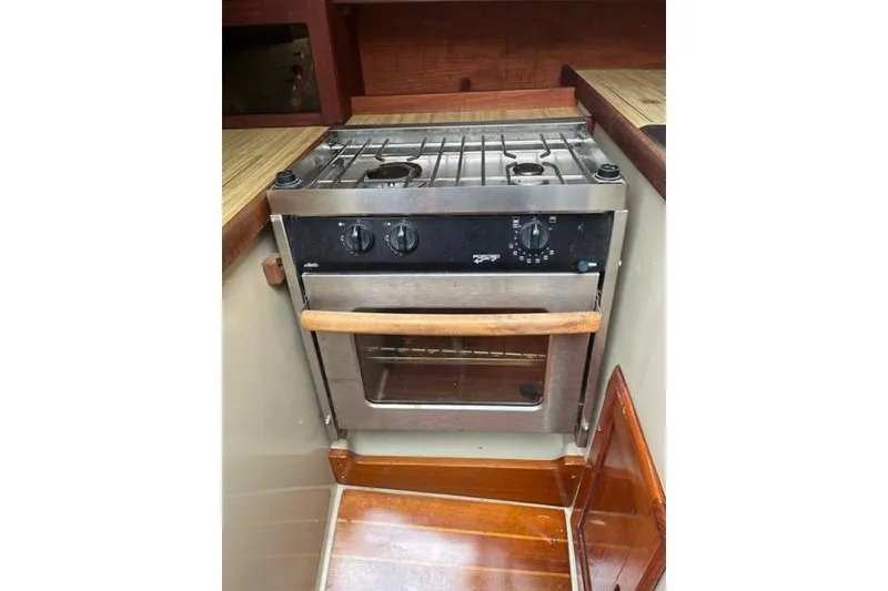 Slide: The Image of 1982 Catalina 38 yacht kitchen with stainless steel stove and oven. - 9
