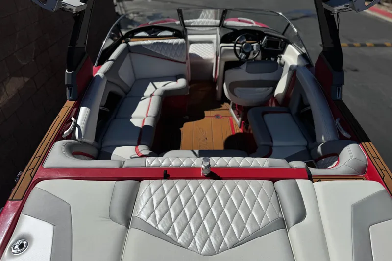 Slide: The Image of 2017 Tigé RZ2 boat interior with luxurious seating and modern dashboard. - 12