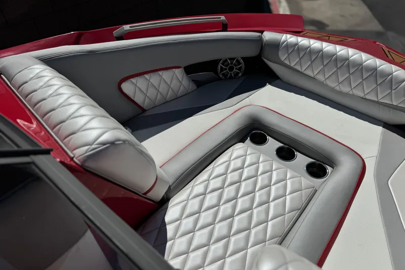 Slide: The Image of Luxurious interior of 2017 Tigé RZ2 boat with diamond-stitched upholstery and cup holders. - 15