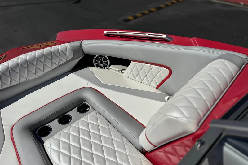 Slide: The Image of Luxurious interior of 2017 Tigé RZ2 boat with quilted seats and cup holders. - 16