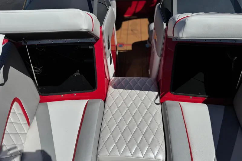 Slide: The Image of 2017 Tigé RZ2 boat interior with red and white upholstery, featuring diamond-patterned seating. - 17