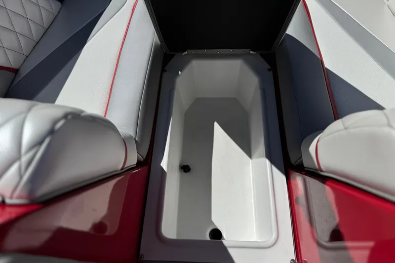 Slide: The Image of 2017 Tigé RZ2 boat interior storage compartment with red and white upholstery. - 18