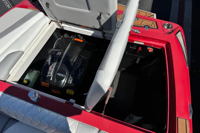 Slide: The Image of 2017 Tigé RZ2 boat engine compartment with open hatch, showcasing Raptor 6.2L engine. - 29