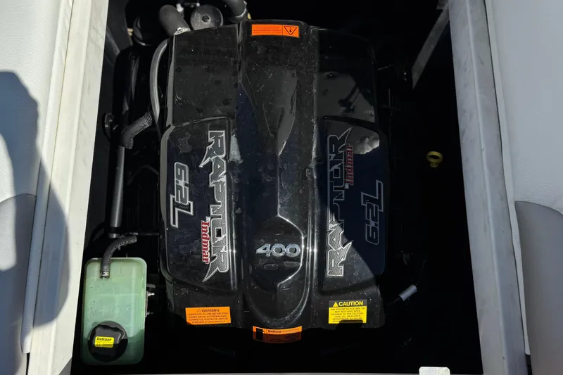 Slide: The Image of 2017 Tigé RZ2 boat engine, Raptor 6.2L by Indmar, black cover with labels. - 30