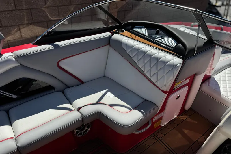 Slide: The Image of Interior of a 2017 Tigé RZ2 boat with white and red seating. - 31