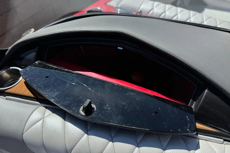 Slide: The Image of Open storage compartment in 2017 Tigé RZ2 boat with quilted upholstery. - 34