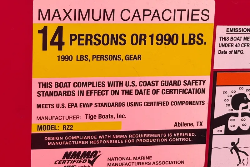 Slide: The Image of 2017 Tigé RZ2 boat capacity label, maximum 14 persons or 1990 lbs, safety compliance. - 47