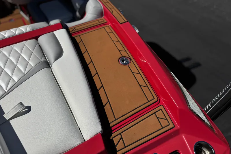 Slide: The Image of 2017 Tigé RZ2 boat interior with red and white upholstery, featuring a stylish design. - 8