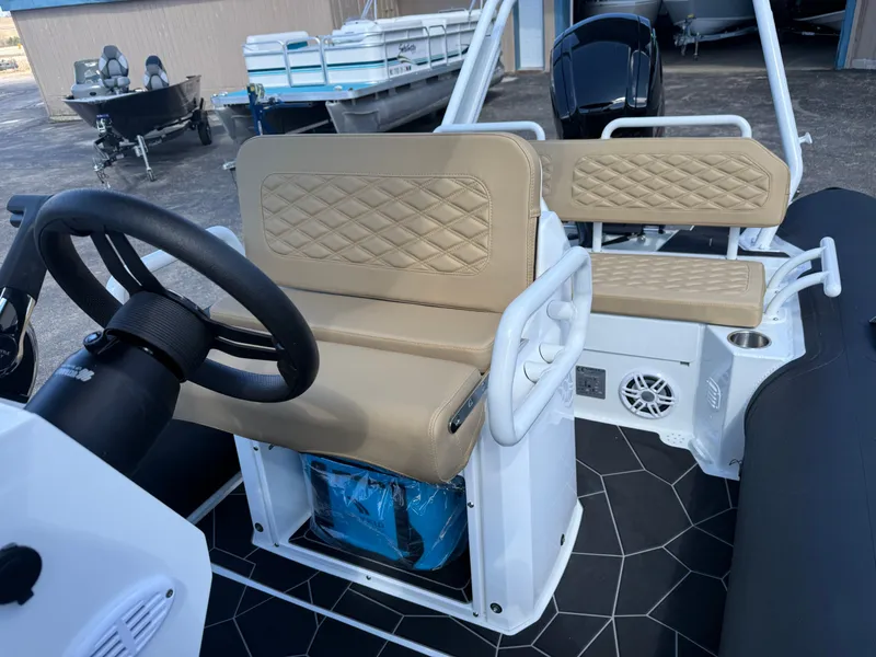 Slide: The Image of Interior of Highfield Sport 560 boat, 2026 model, featuring beige seating. - 11