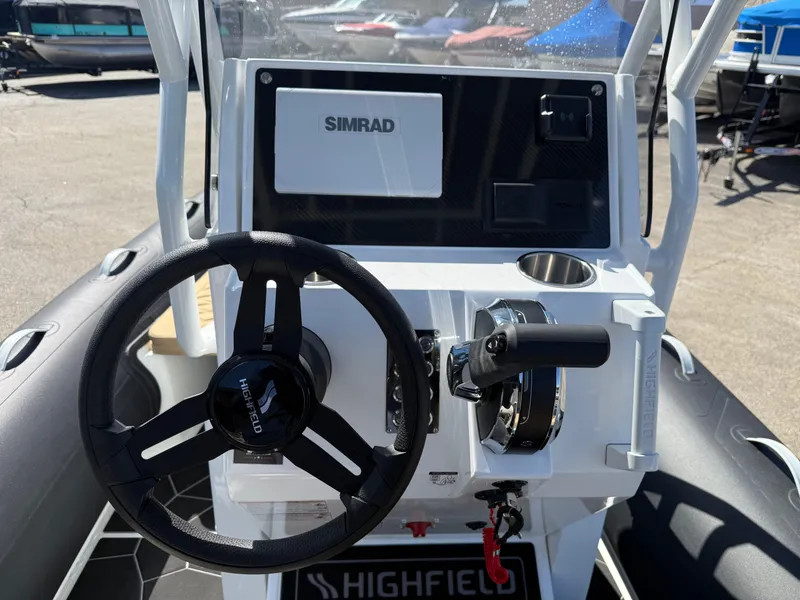 Slide: The Image of Steering console of Highfield Sport 560 boat, model year 2026. - 12