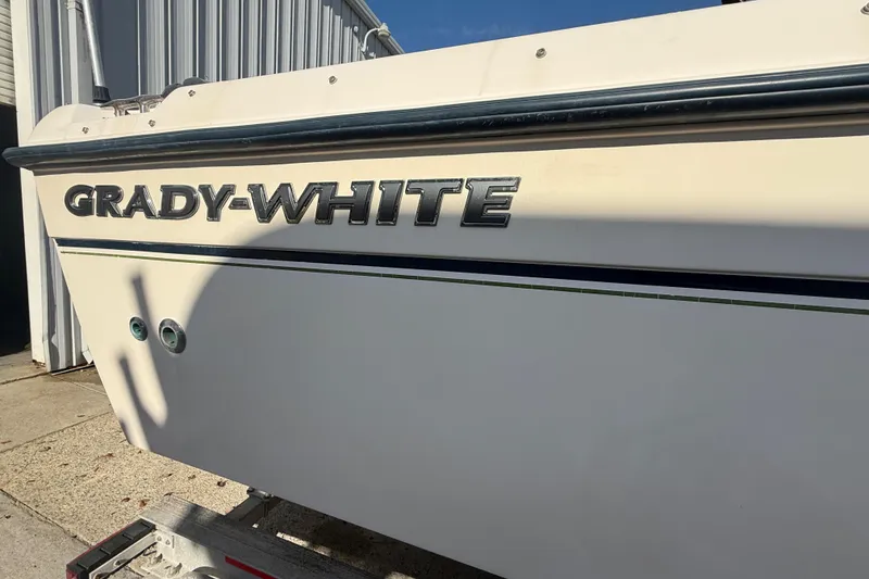 Slide: The Image of 2008 Grady-White Tournament 225 boat side view with logo in sunlight. - 3