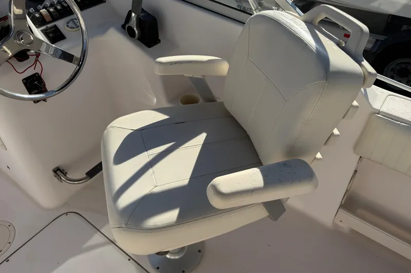Slide: The Image of Captain's chair and steering wheel on 2008 Grady-White Tournament 225 boat. - 5
