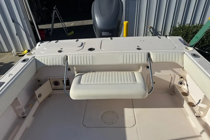 Slide: The Image of 2008 Grady-White Tournament 225 boat interior with seating and storage compartments. - 7