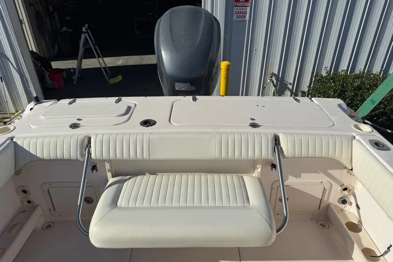 Slide: The Image of 2008 Grady-White Tournament 225 boat interior with seating and storage compartments. - 8
