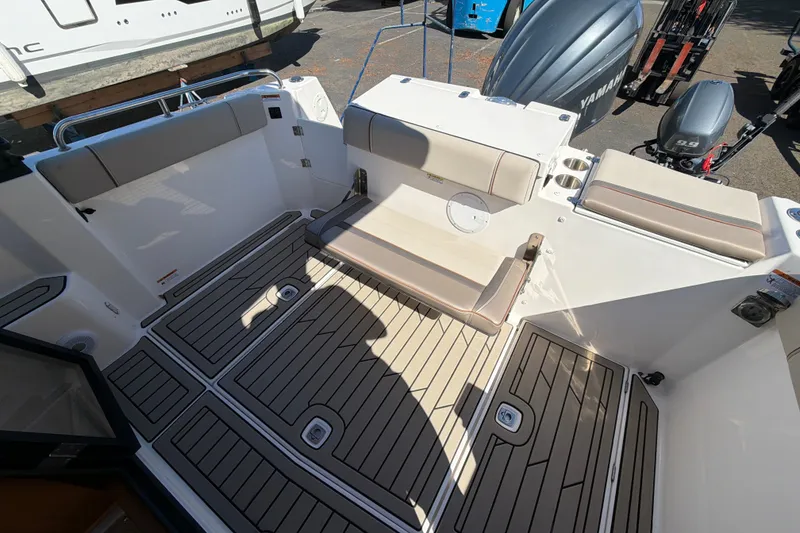 Slide: The Image of 2023 Cutwater C-248 Coupe boat interior with seating and Yamaha outboard motor. - 10