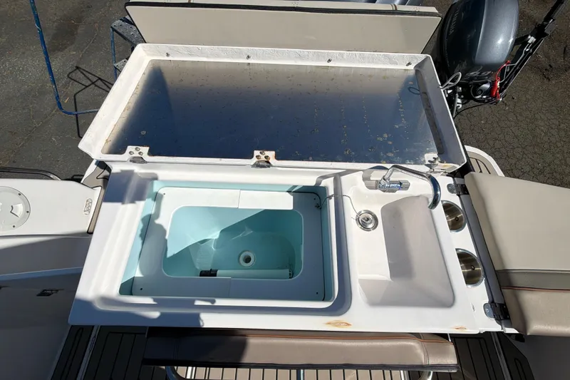 Slide: The Image of 2023 Cutwater C-248 Coupe boat sink and storage compartment on deck. - 13