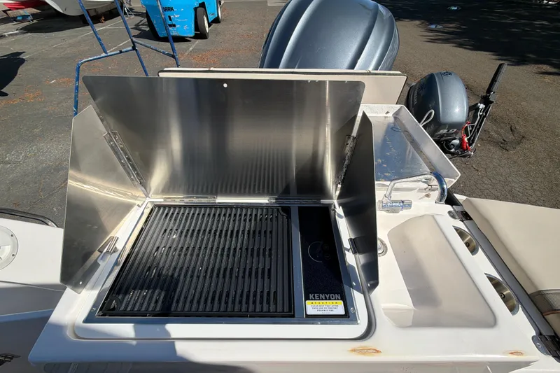 Slide: The Image of Outdoor grill and sink on 2023 Cutwater C-248 Coupe boat deck. - 14
