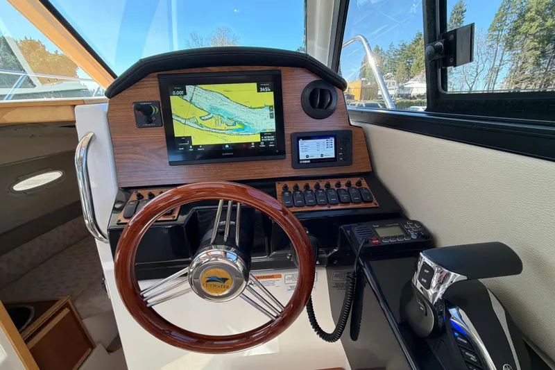 Slide: The Image of 2023 Cutwater C-248 Coupe helm with navigation display and controls. - 18