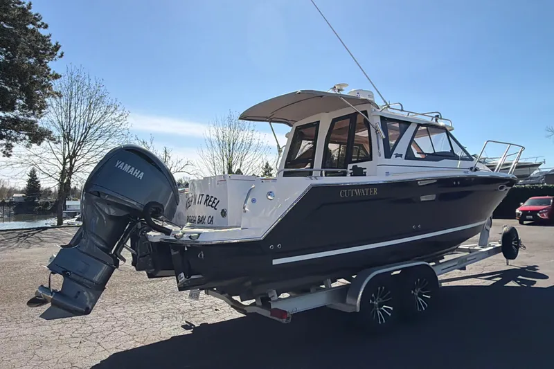 Slide: The Image of 2023 Cutwater C-248 Coupe boat on trailer with Yamaha outboard motor. - 2