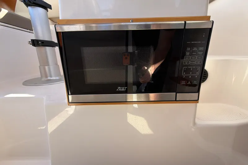 Slide: The Image of Built-in microwave in 2023 Cutwater C-248 Coupe boat interior. - 23