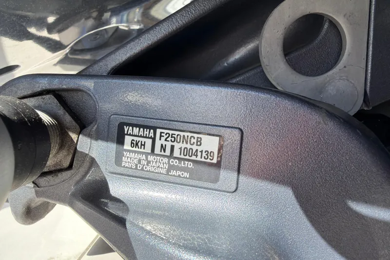 Slide: The Image of Close-up of Yamaha F250NCB engine label on 2023 Cutwater C-248 Coupe. - 29