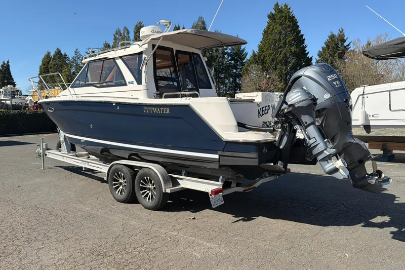 Slide: The Image of 2023 Cutwater C-248 Coupe boat on trailer with Yamaha outboard motor. - 3