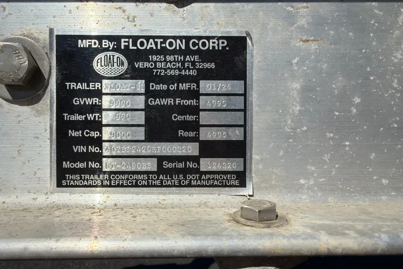 Slide: The Image of Float-On Corp trailer label with specifications and manufacturing details, including GVWR and VIN. - 31