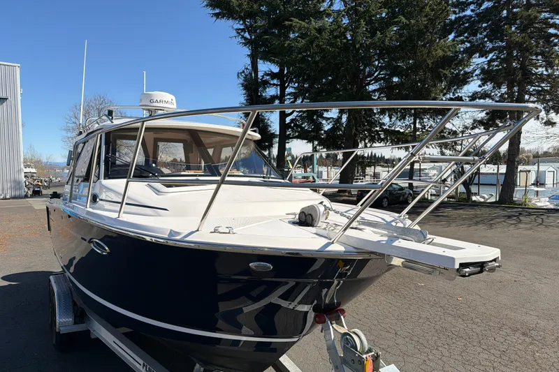 Slide: The Image of 2023 Cutwater C-248 Coupe boat parked outdoors, featuring sleek design and modern equipment. - 7