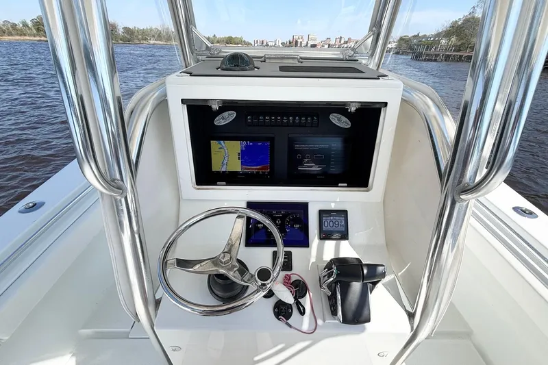 Slide: The Image of Center console of a 2011 Onslow Bay 27 Offshore boat with navigation equipment. - 15