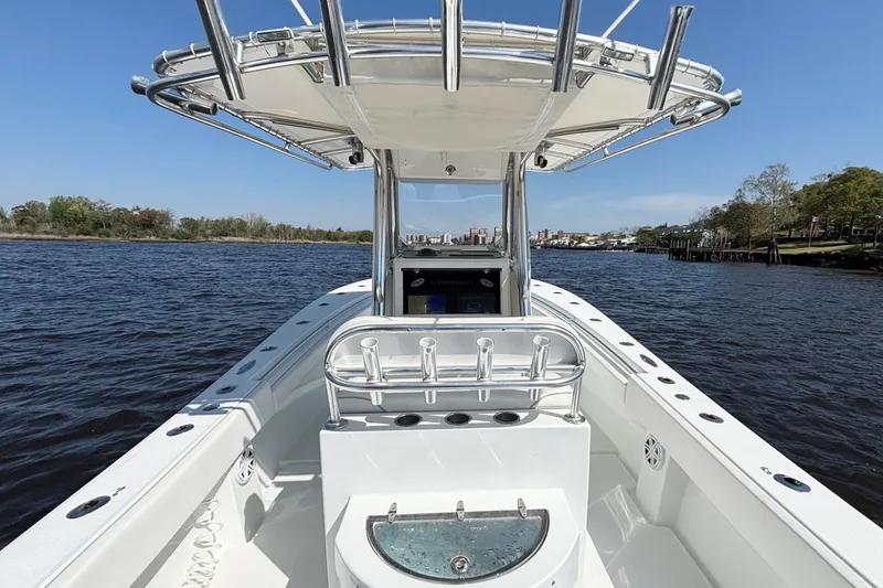 Slide: The Image of 2011 Onslow Bay 27 Offshore boat on calm river under clear blue sky. - 17