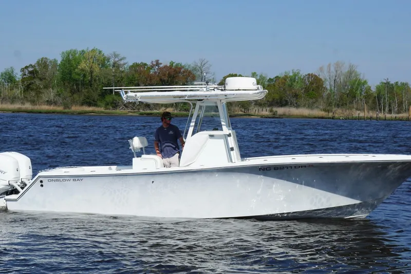 Slide: The Image of 2011 Onslow Bay 27 Offshore boat cruising on a scenic waterway. - 3