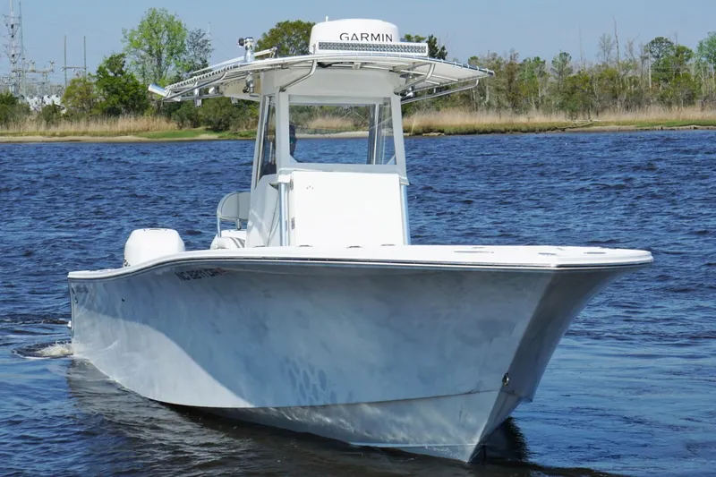 Slide: The Image of 2011 Onslow Bay 27 Offshore boat cruising on a calm lake. - 5